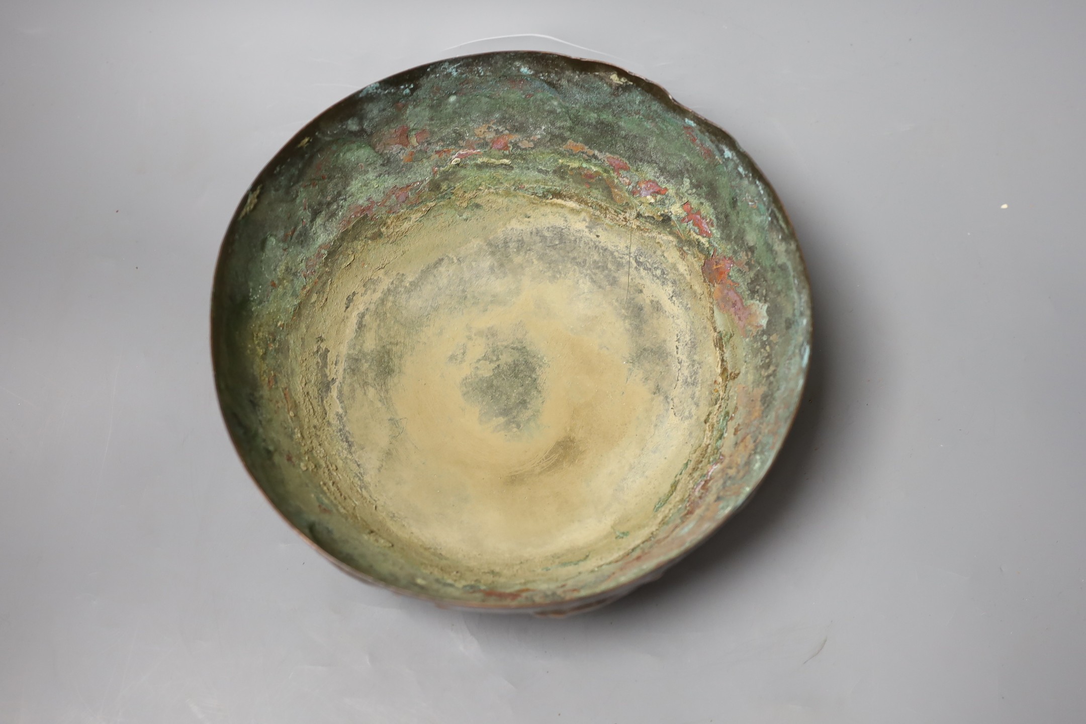 A Newlyn style planished copper ‘fish’ bowl, 24.5 cms diameter